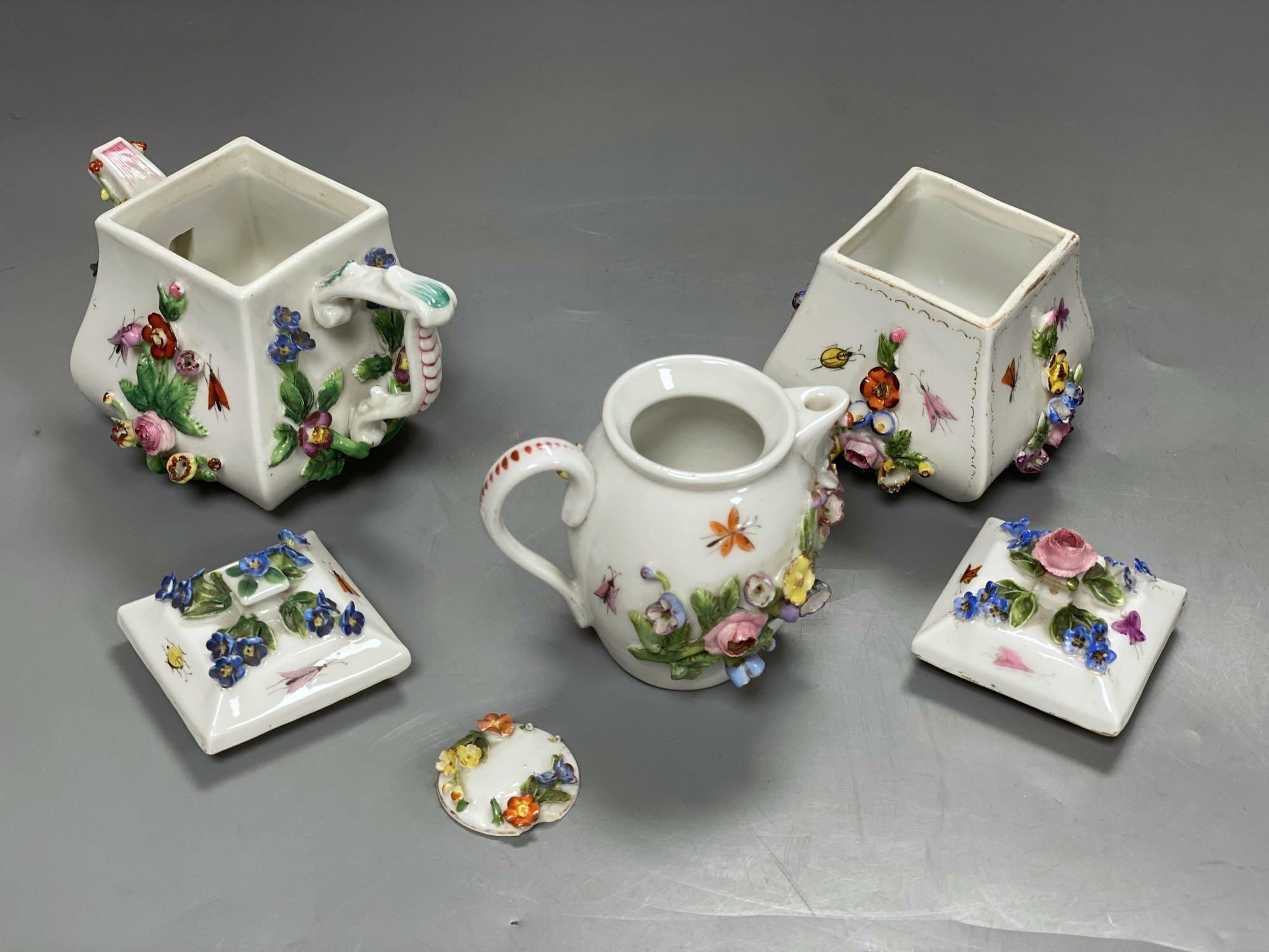 A late 19th century French porcelain flower encrusted cafe au lait set, on stand, stand 27cm